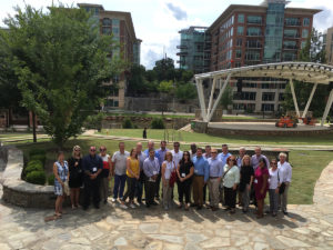 group of people pose for a photo during an inter-city visit to greenville south carolina