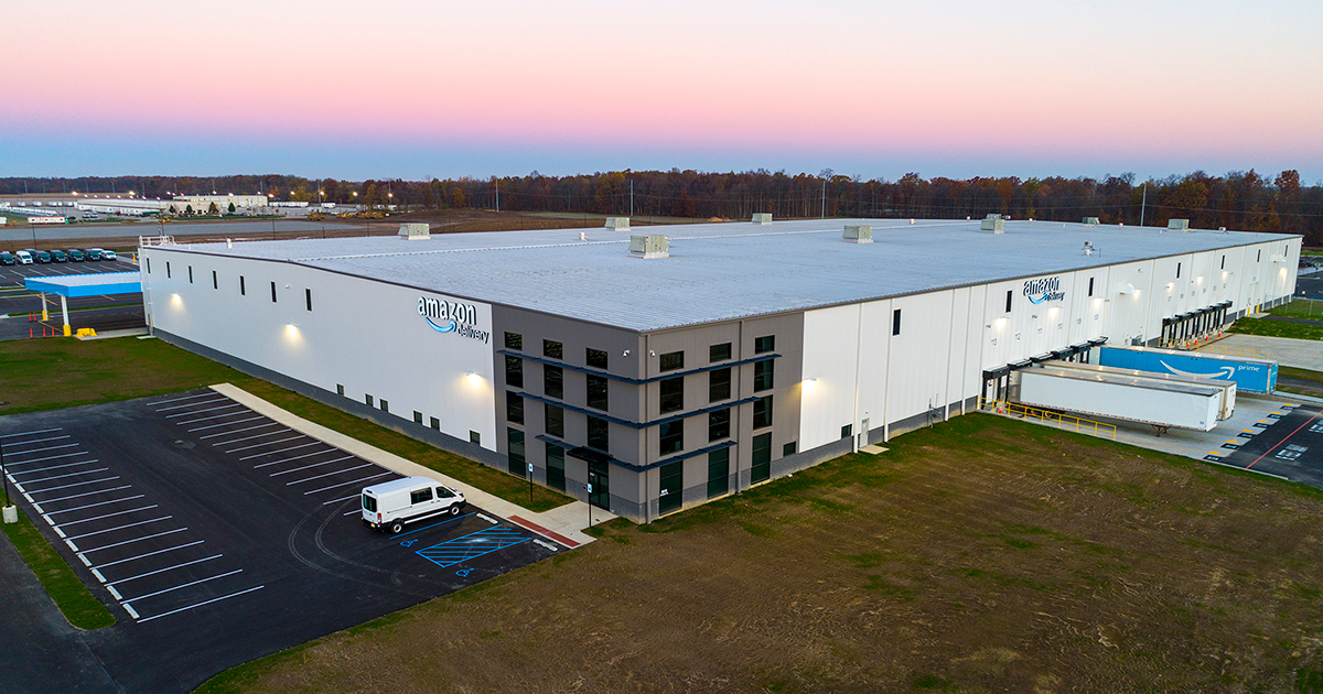 exterior photo of amazon delivery station at dawn