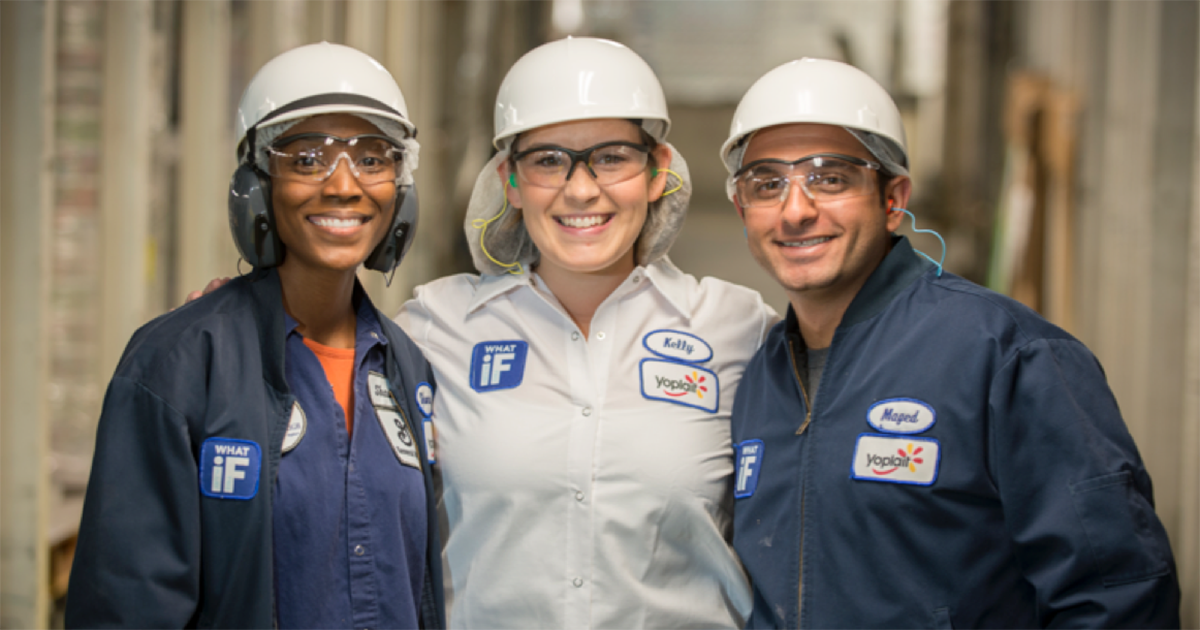 3 General Mills employees wearing hard hats and safety goggles