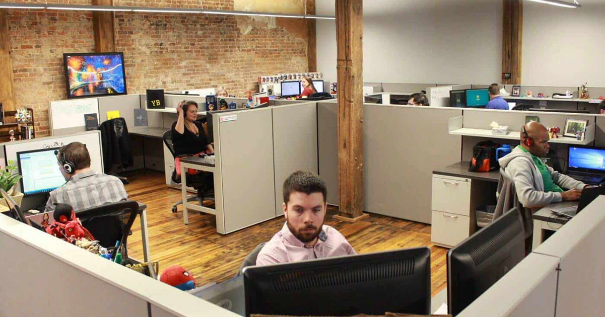 group of information technology workers using computers