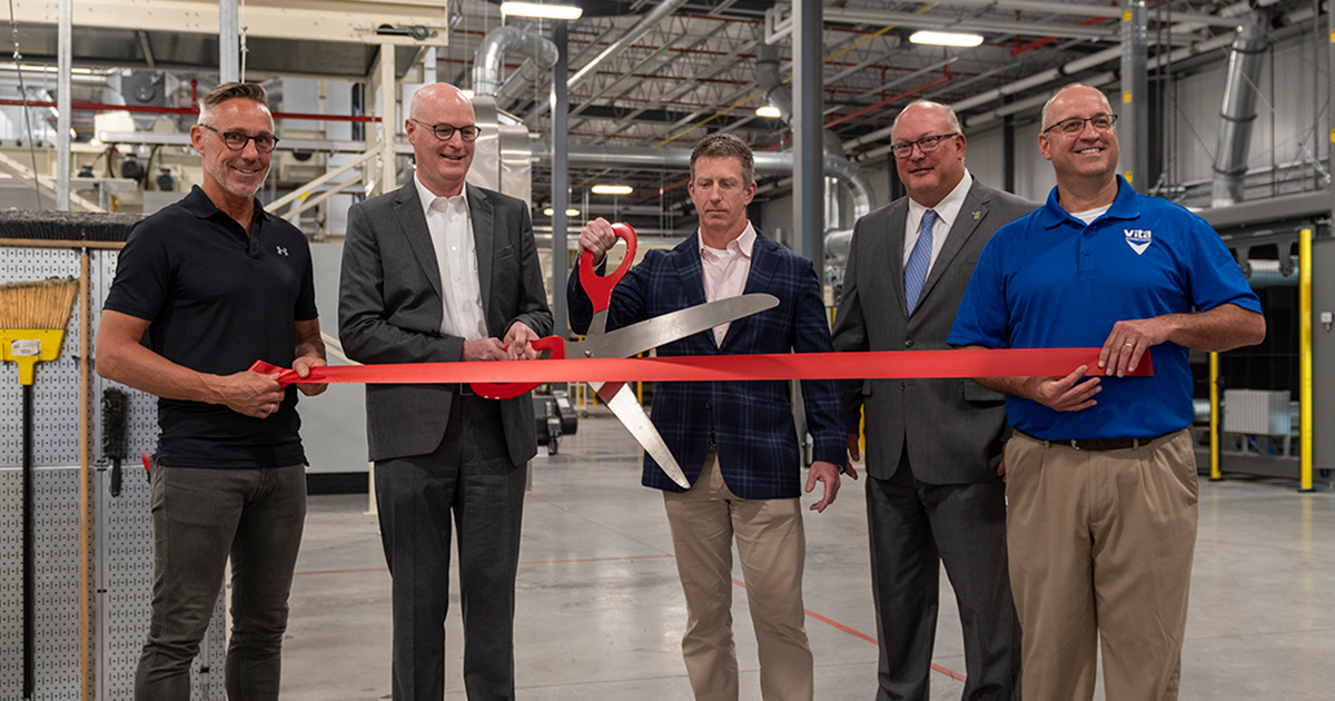 group of men at a ribbon-cutting ceremony