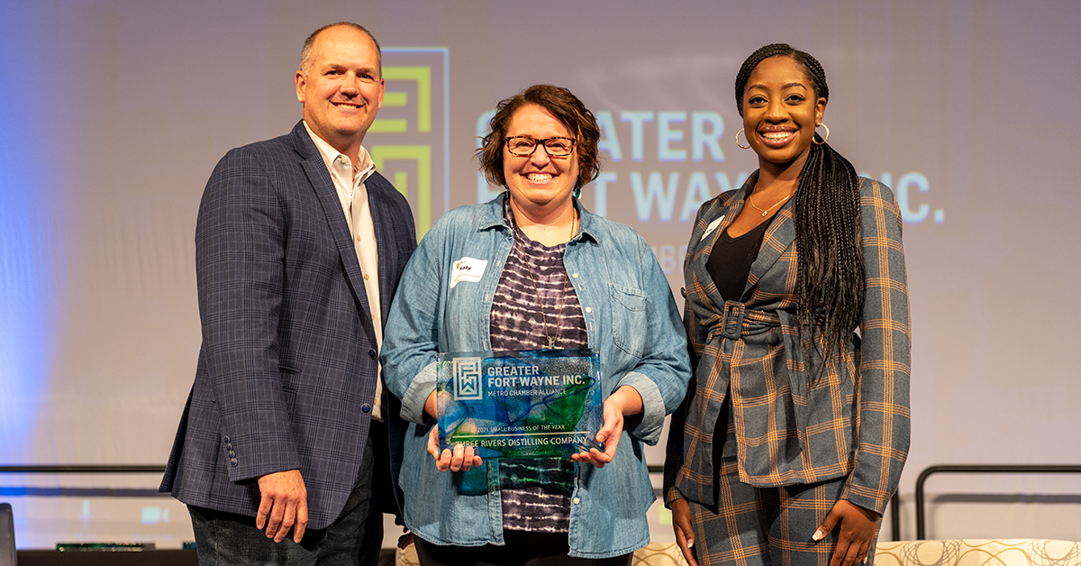 John Urbahns and Aaryn Eady present the 2021 Small Business of the Year Award to Three Rivers Distilling Company