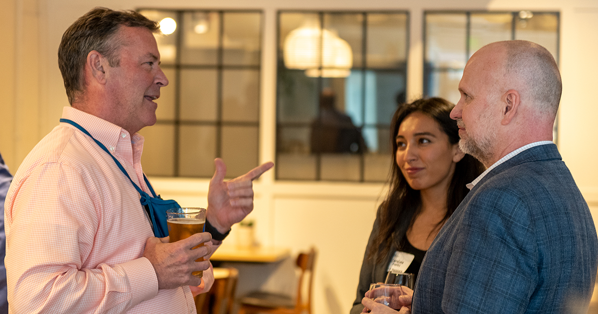 people talking at a social gathering