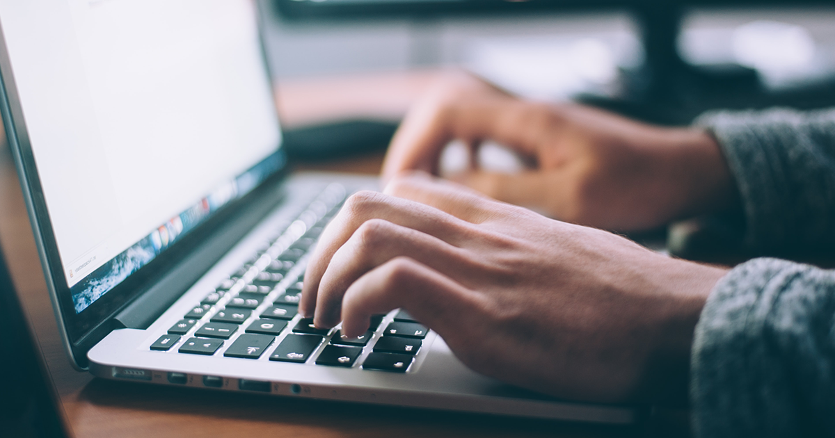 onboard-online-resources hands typing on a laptop computer