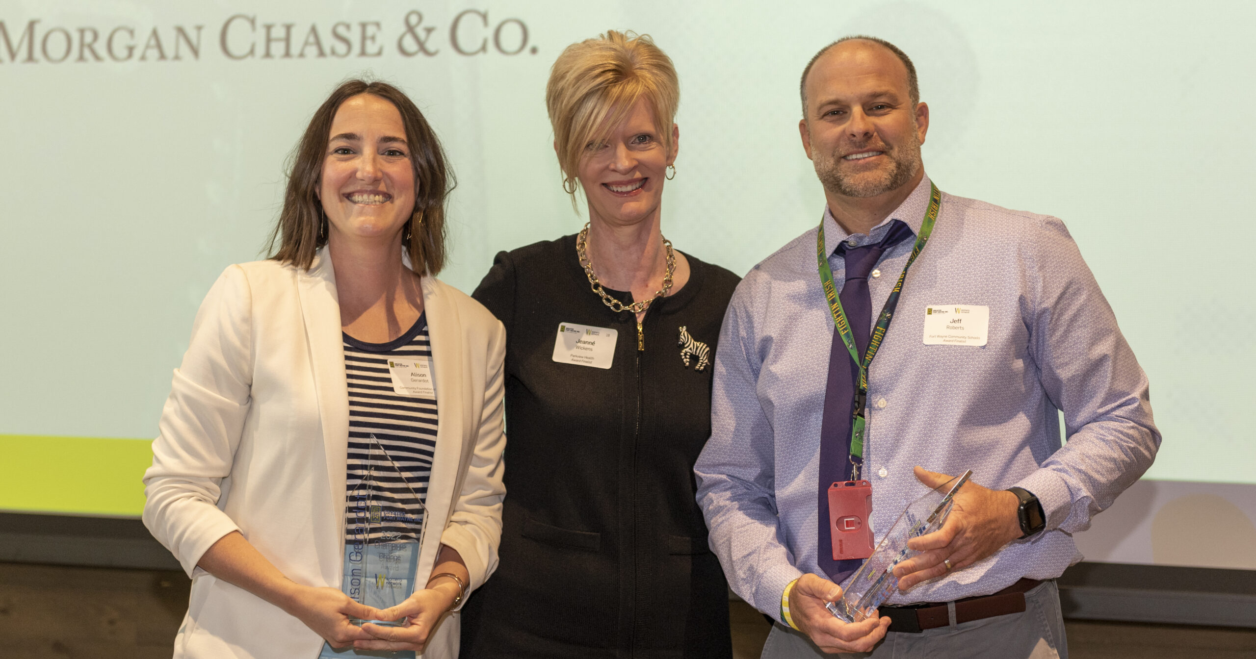 Alison Gerardot, Jeanne Wickens, and Jeff Roberts pose with their Champions of Change awards