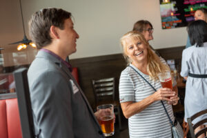two people have a conversation at a meet me at 505 networking event