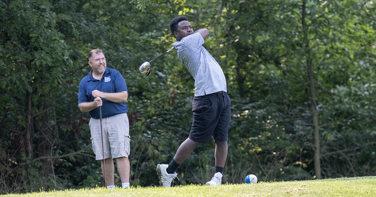 A golfer hits his drive off the tee at the Greater Golf Open.