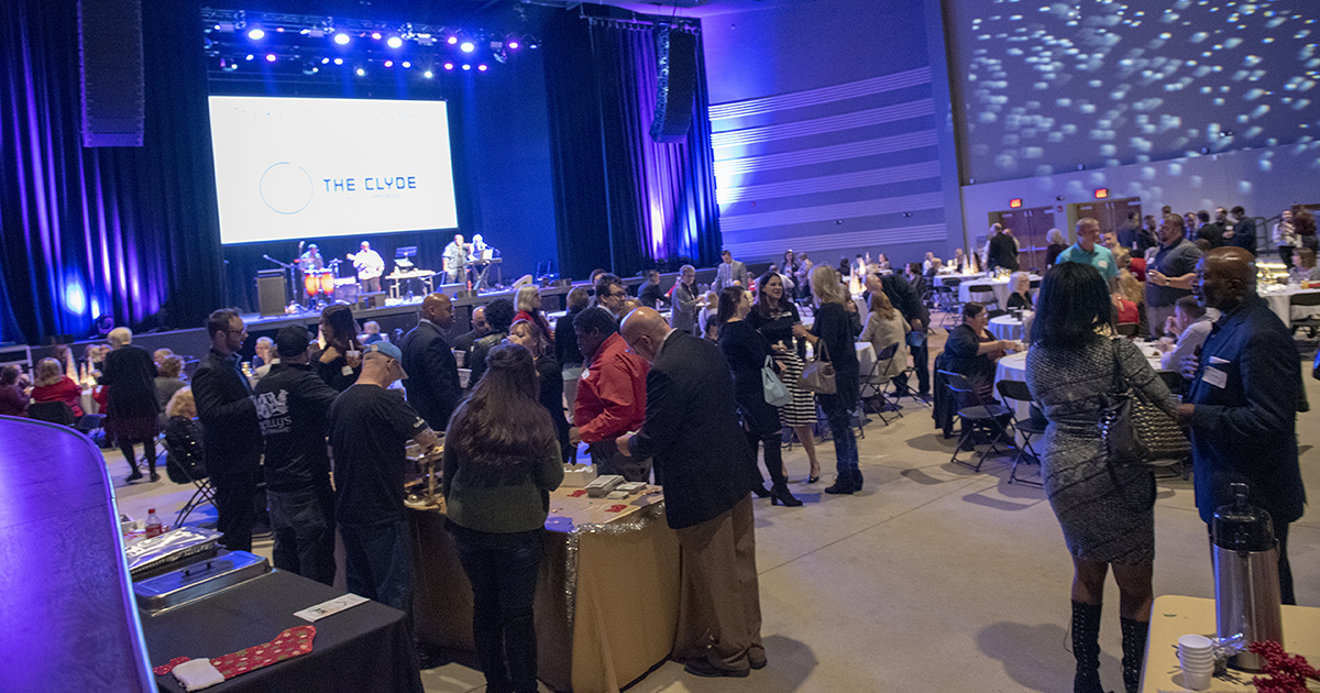 A large crowd mingles at the GFW Inc. Holiday Night event