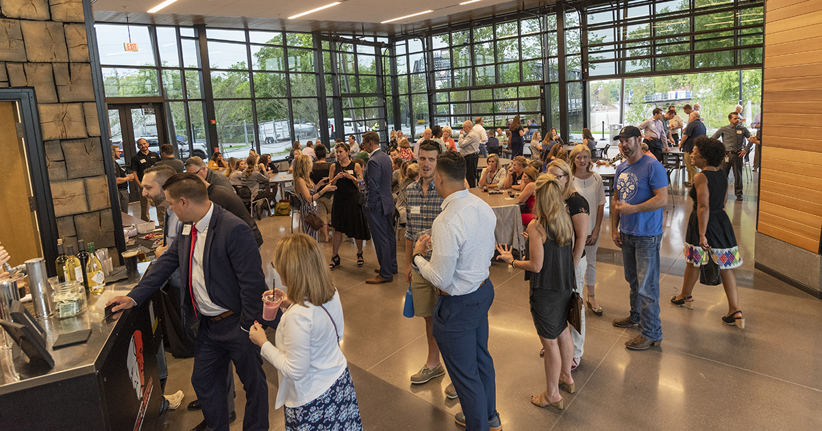 A crowd of people at a Meet Me at 5:05 networking event