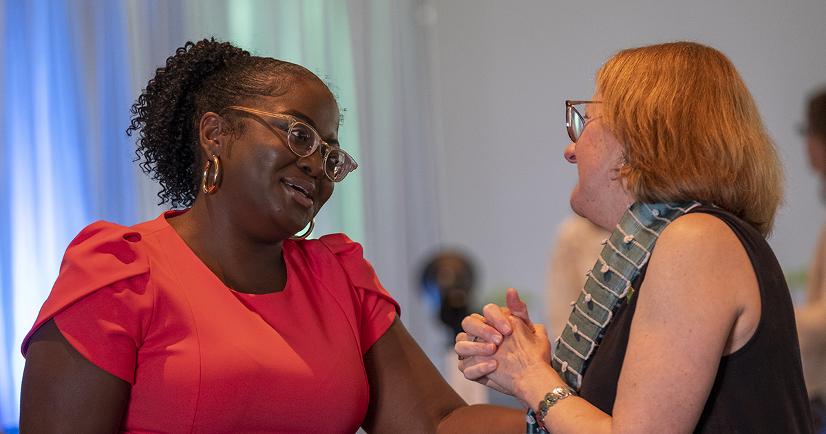 Two women have a conversation at a GFW Inc. Women's Network event