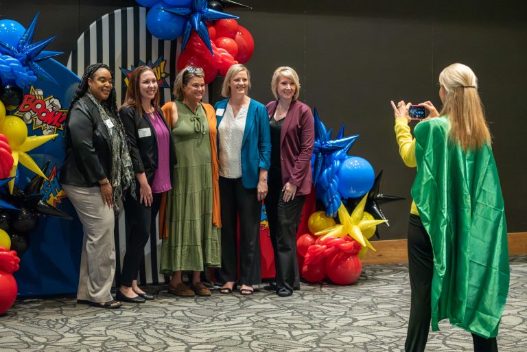 attendees pose for picture