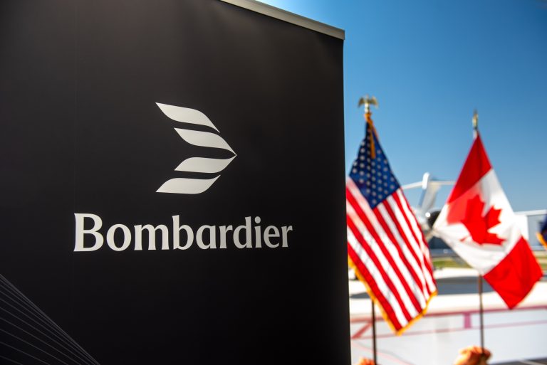 Bombardier logo with the American and Canadian flags in the background.