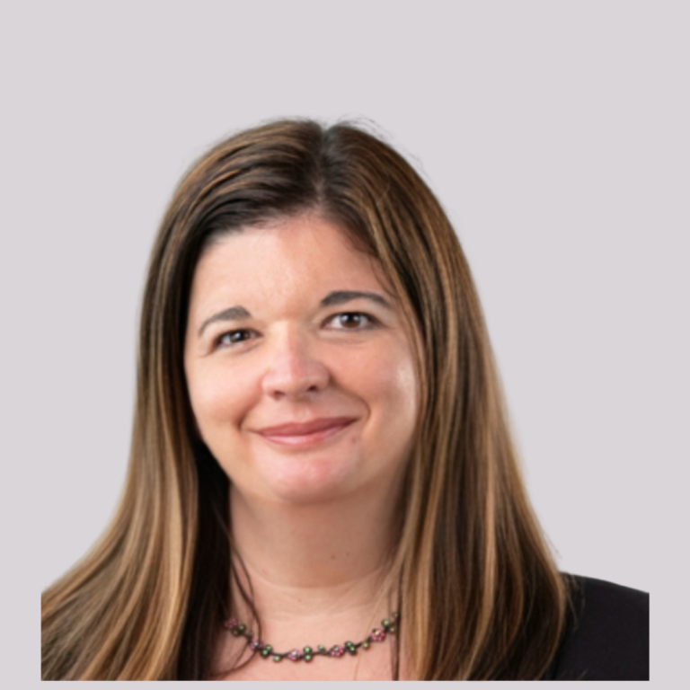 Caucasian female, mid 50's, with medium length brown hair.
