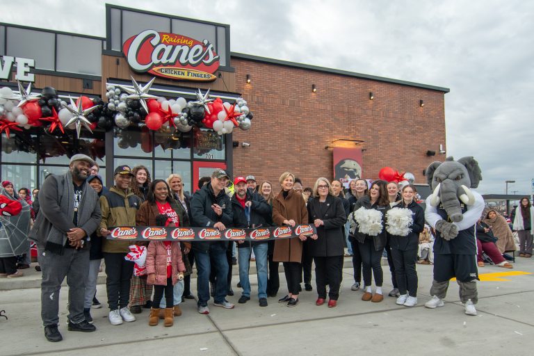 Ribbin Cutting Picture at Raising Canes