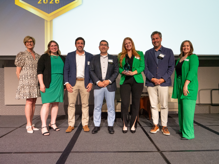 Parkview Health Award winners standing on stage holding award.